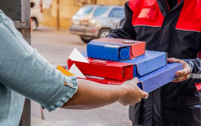 pizza-delivery-courier-giving-pizza-boxes-person